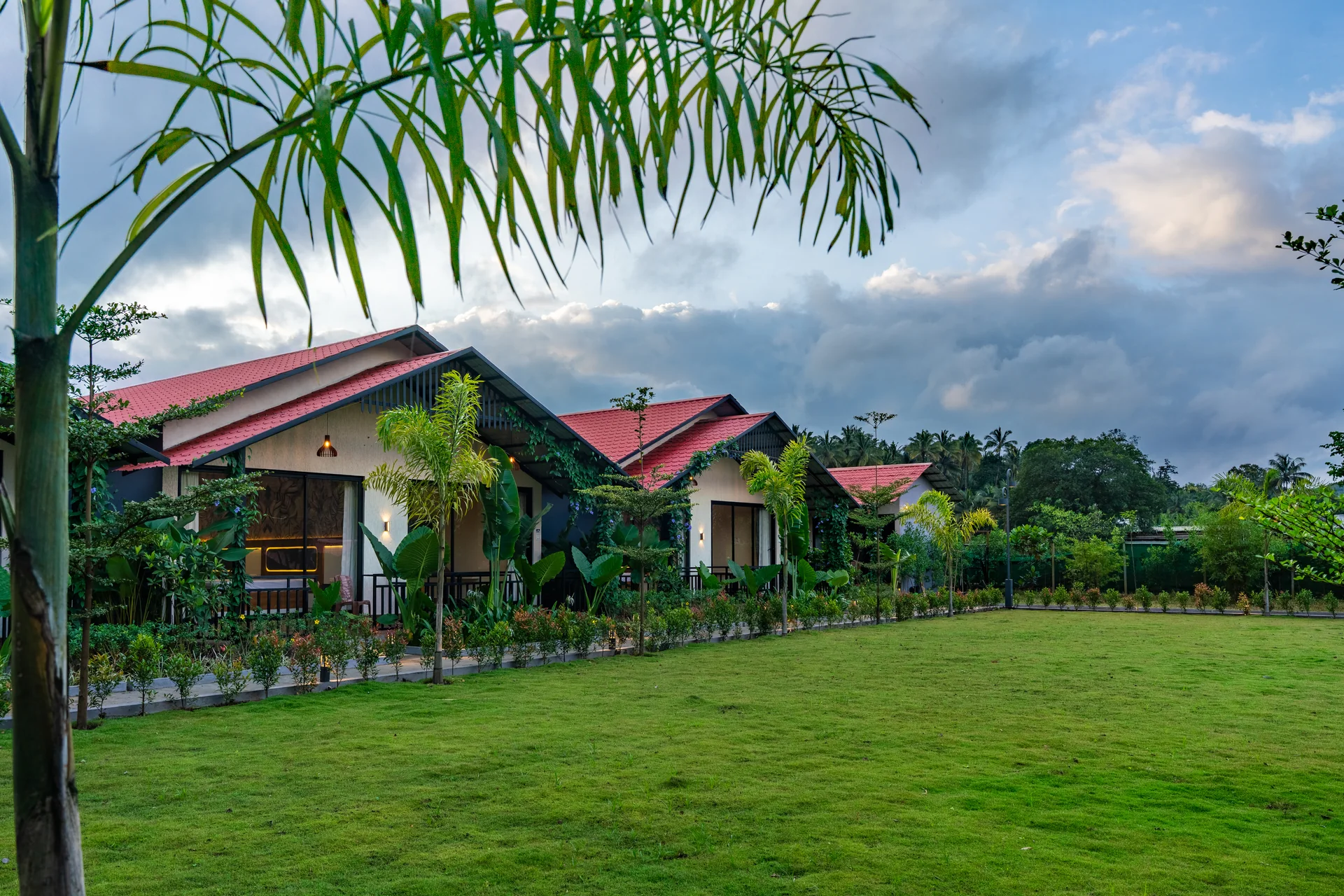 Red-roofed cottages and mountain views at Nadi Teera, Dandeli
