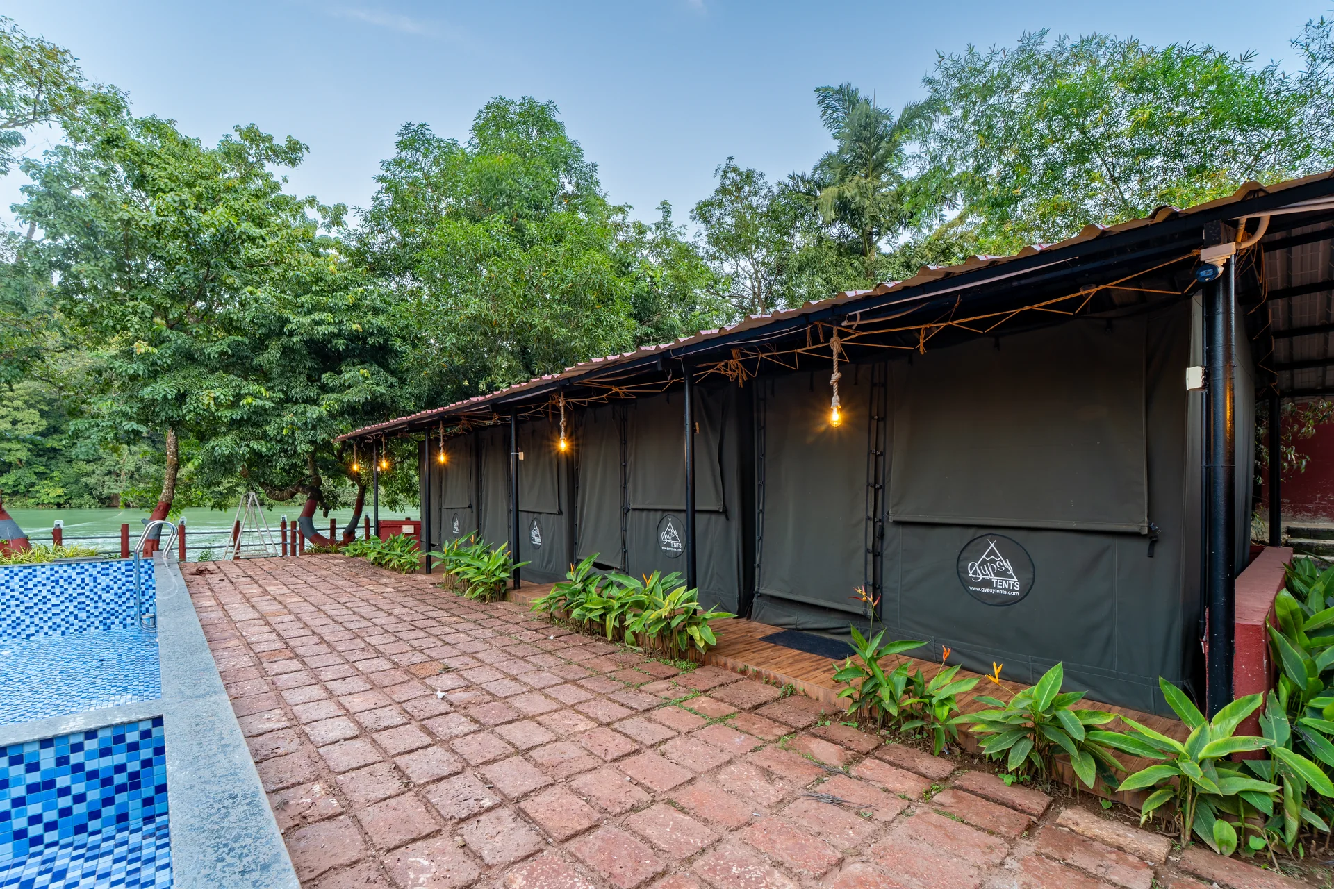 Commando Cottages beside the pool at Nadi Teera, Dandeli