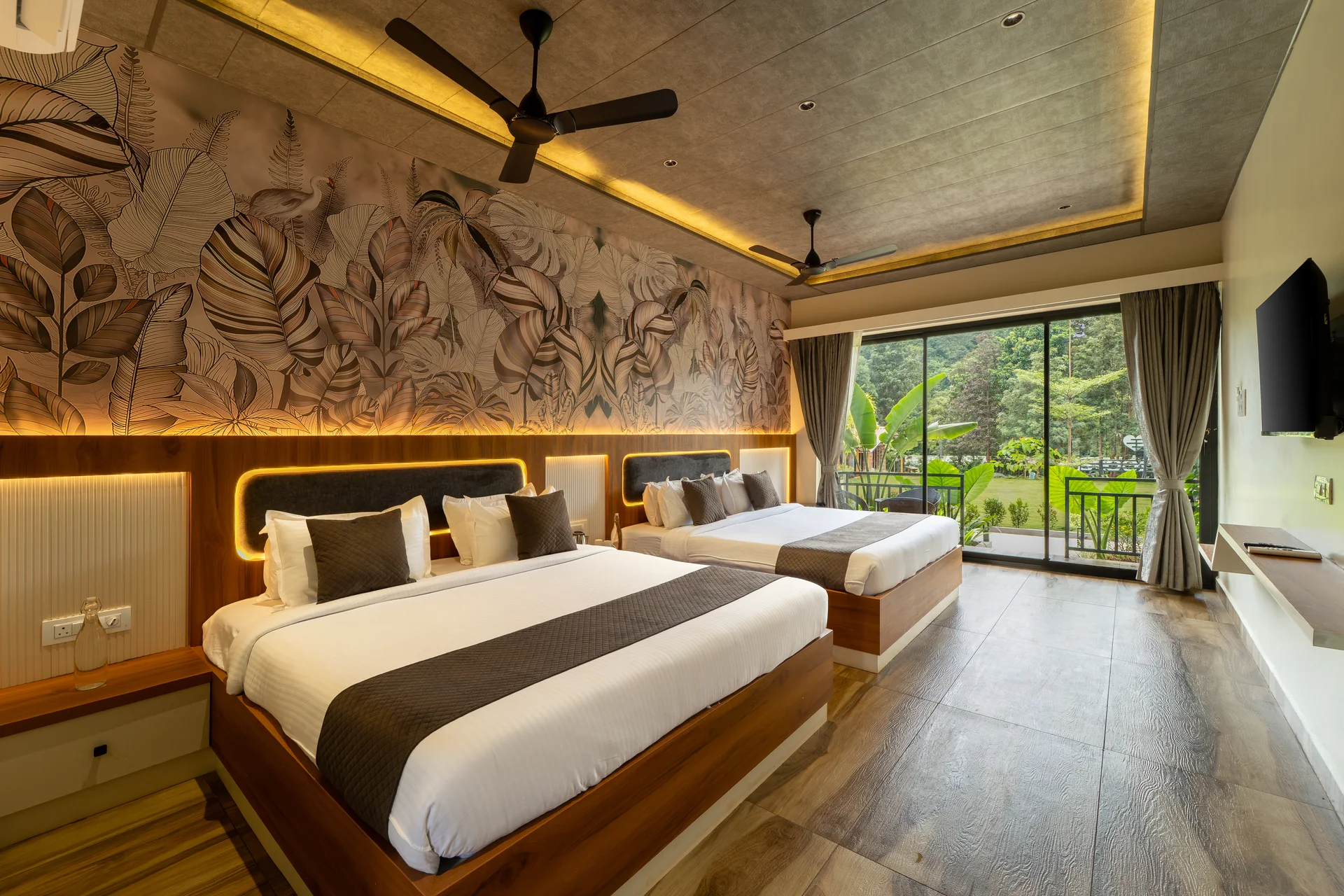 Premium Cottage beds and garden-facing windows at Nadi Teera, Dandeli